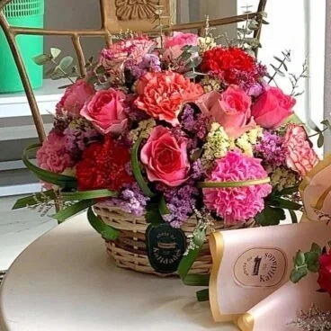 A flower basket on a table by Flower Bar Cebu